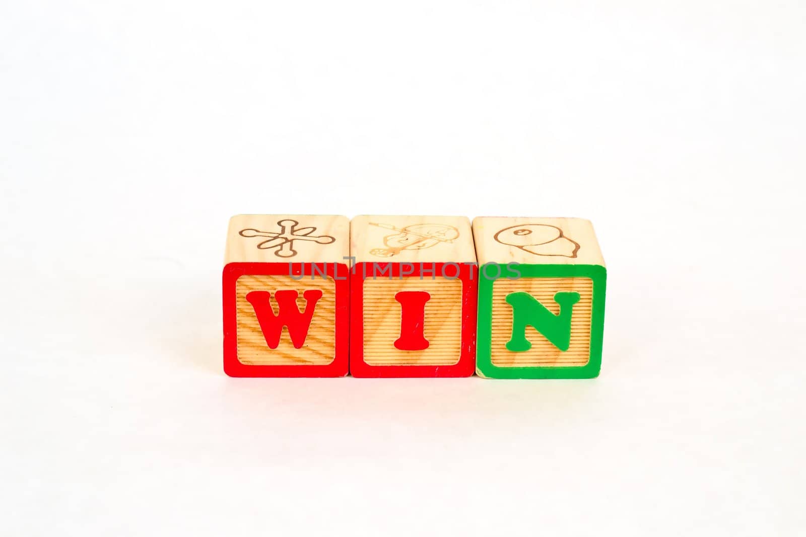 Vintage alphabet blocks spelling out WIN