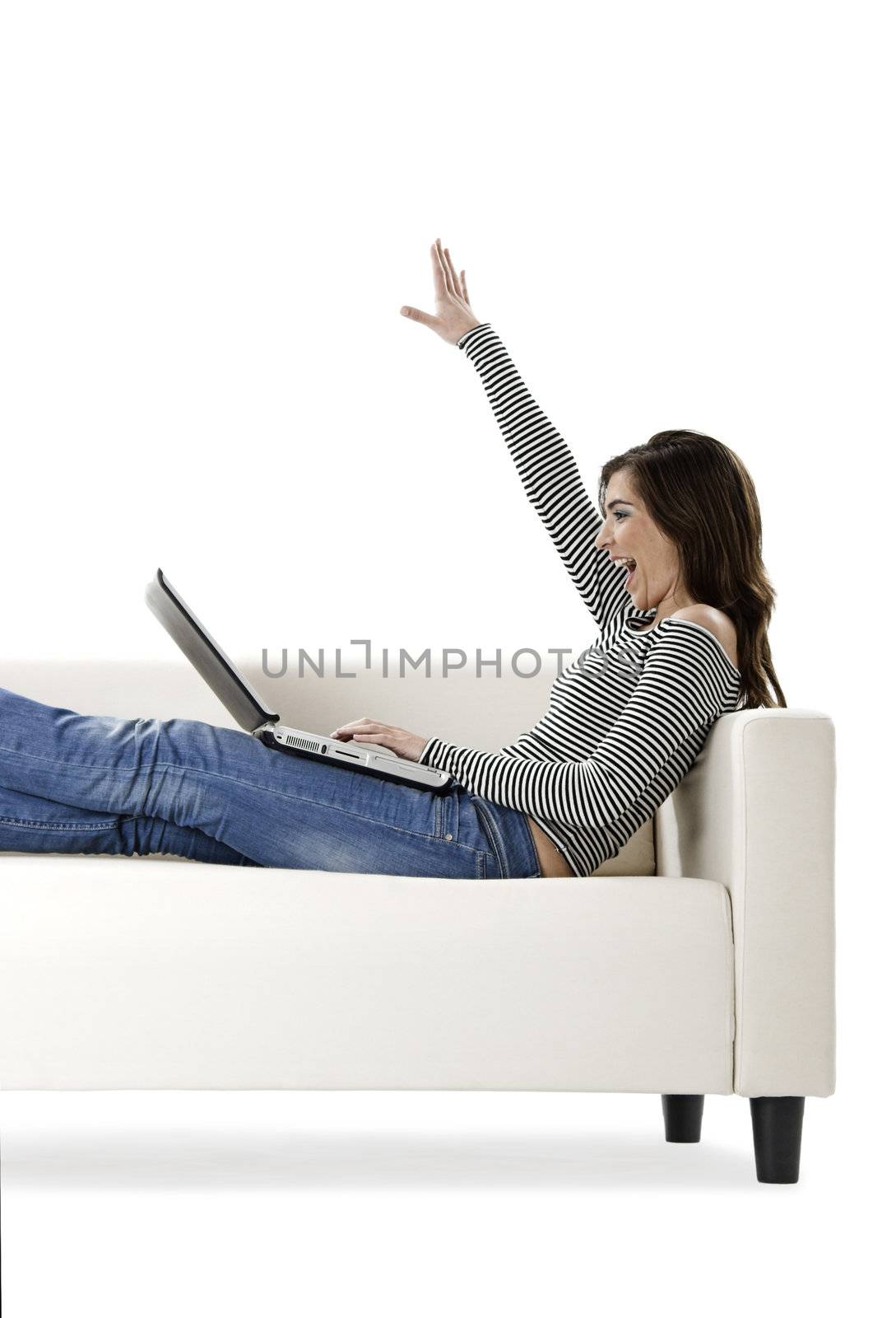 Beautiful and happy young woman working with a laptop