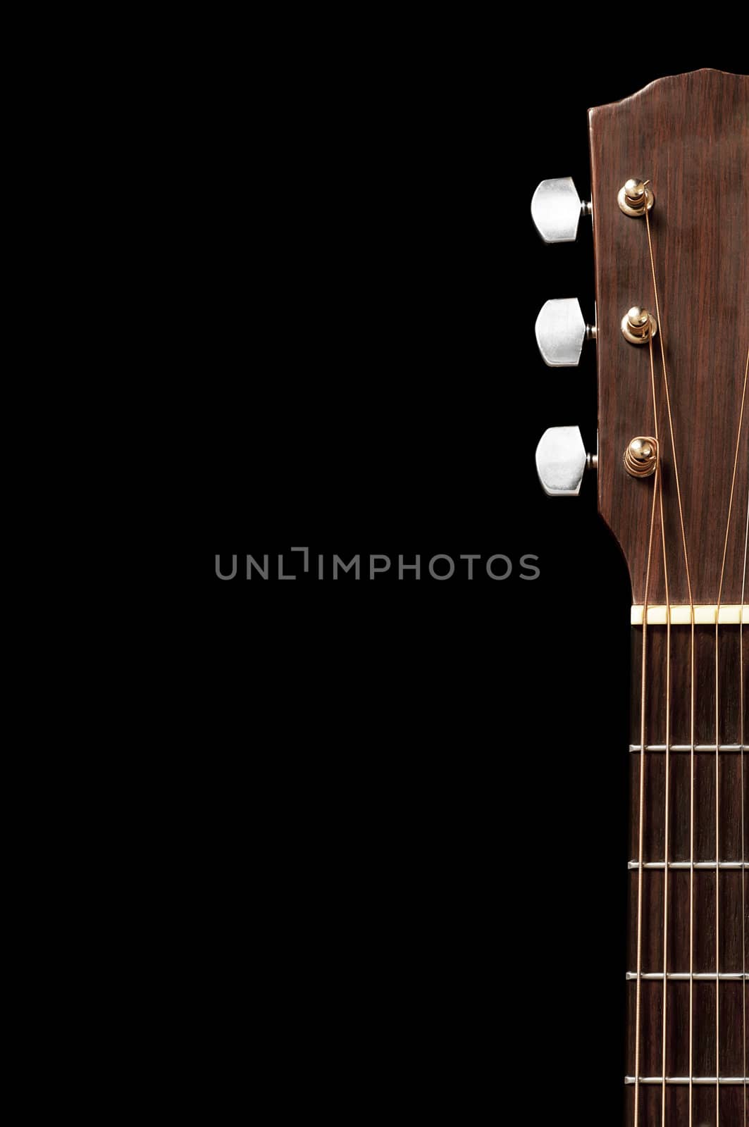 The tuning end of a guitar isolated on a white background.