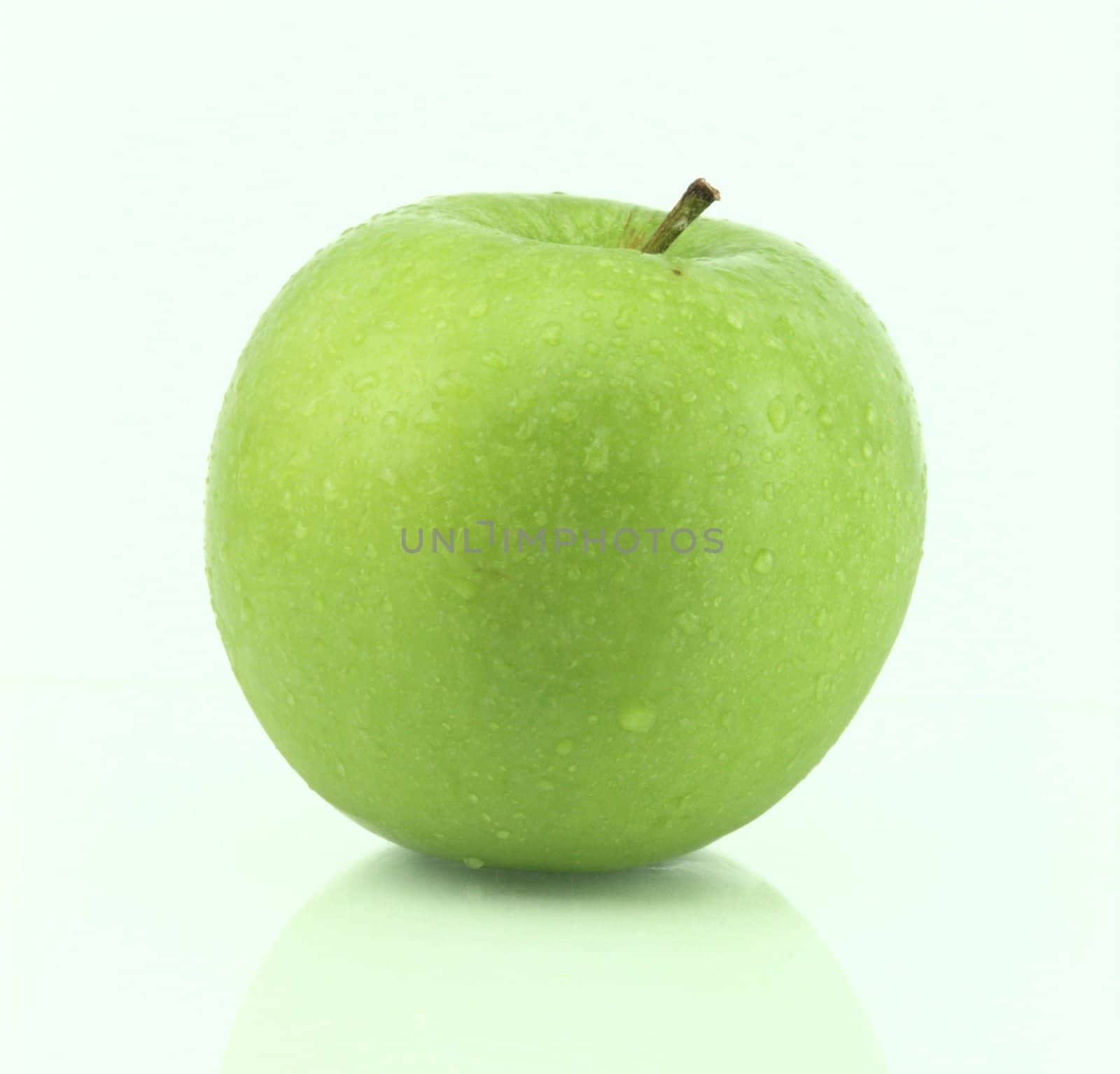 A fresh green apple with water drops