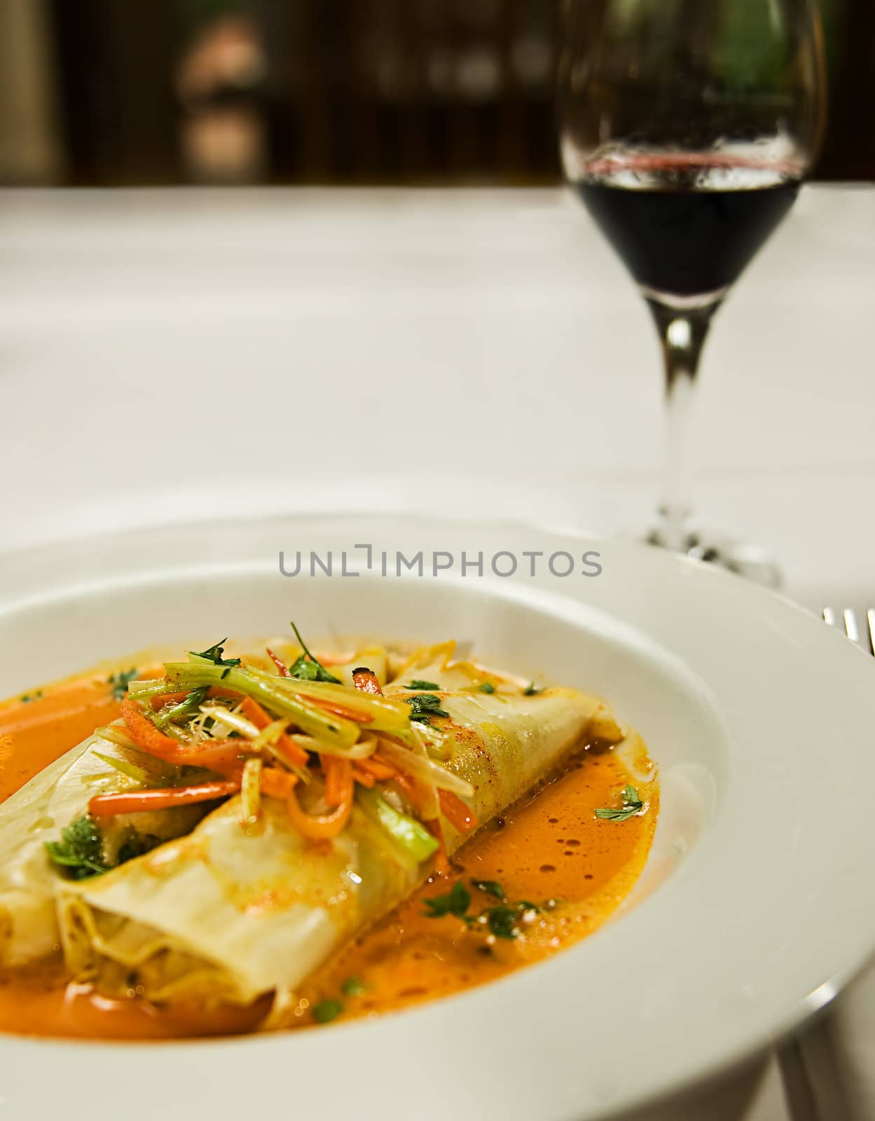 A soup and pasta dish. served with vegetables.