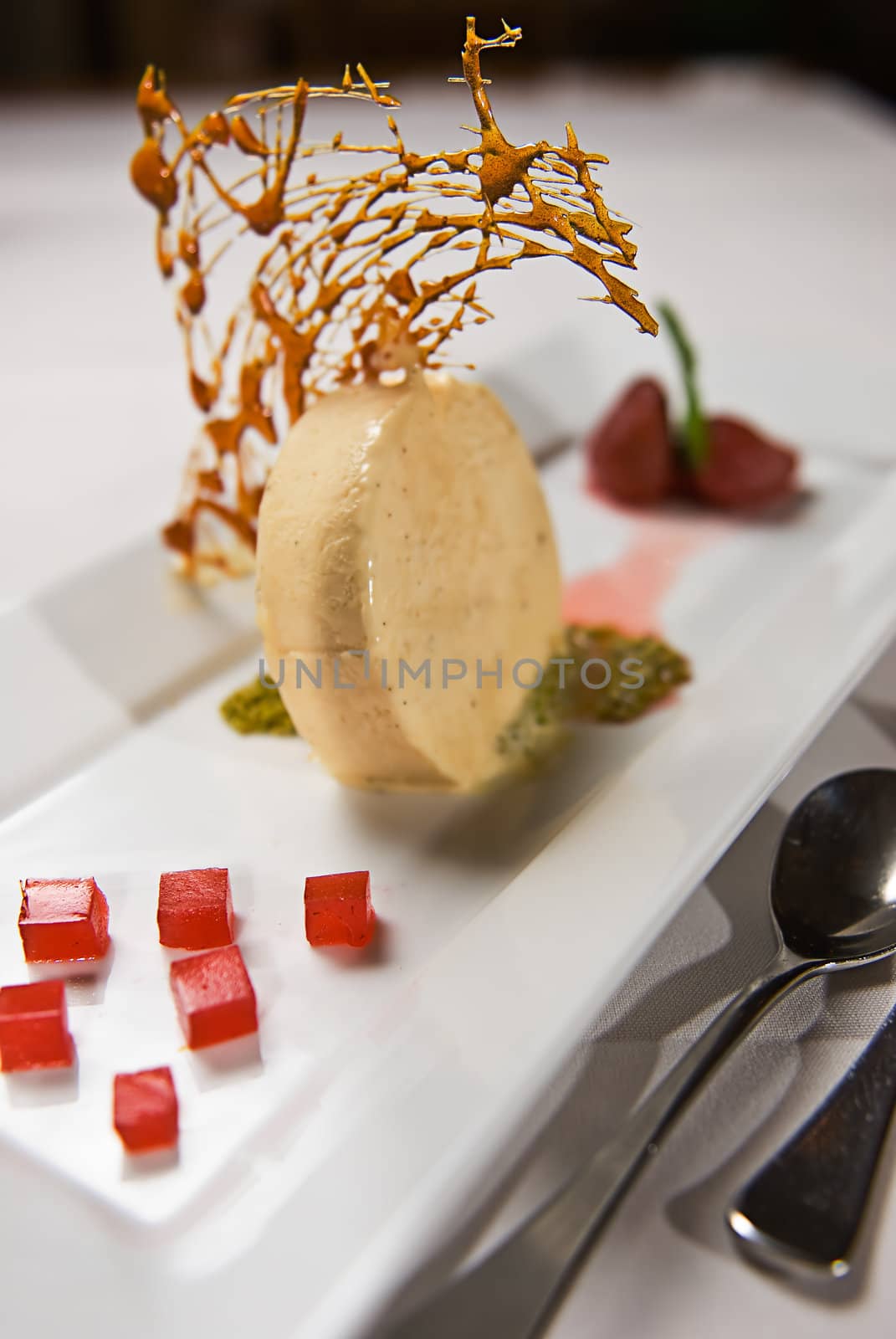 A dessert selection plate of icecream, strawberries etc.