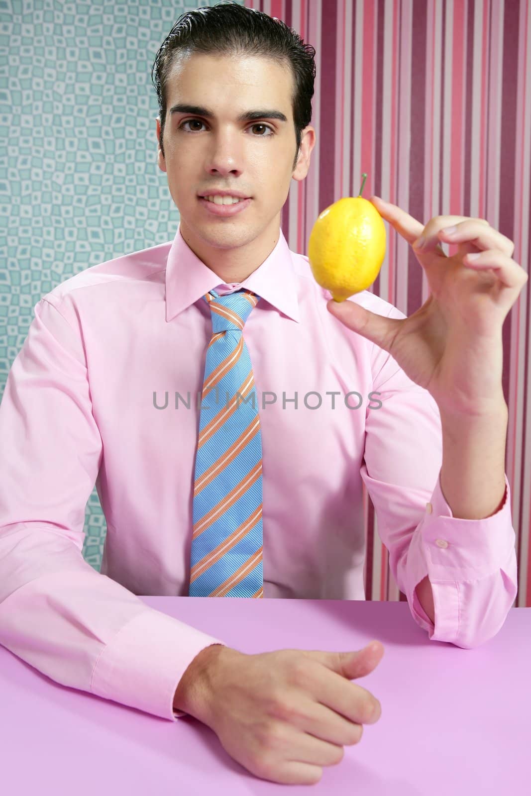 Funny businessman with lemon fruit on hand by lunamarina