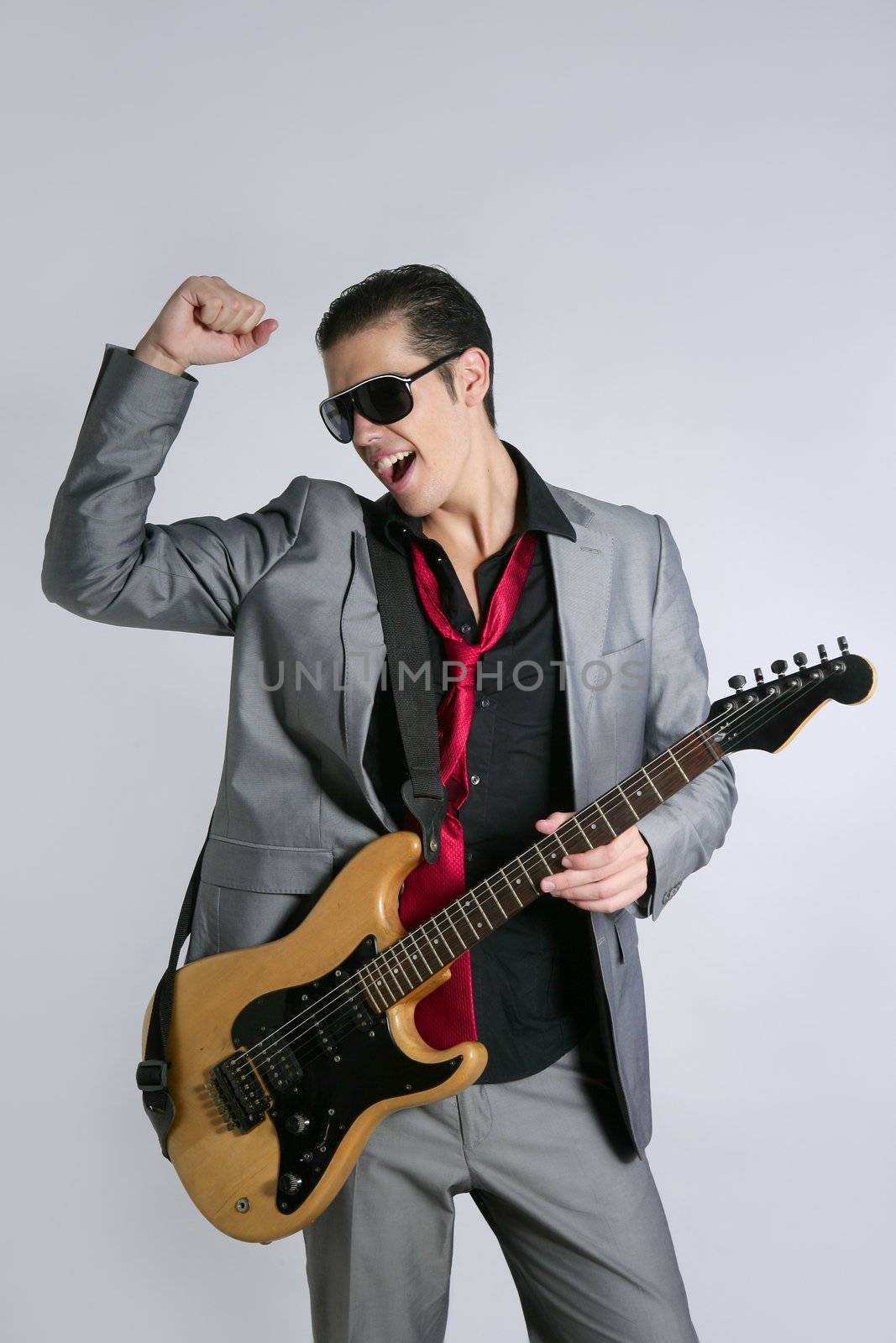 Businessman musician playing instrument with suit and tie