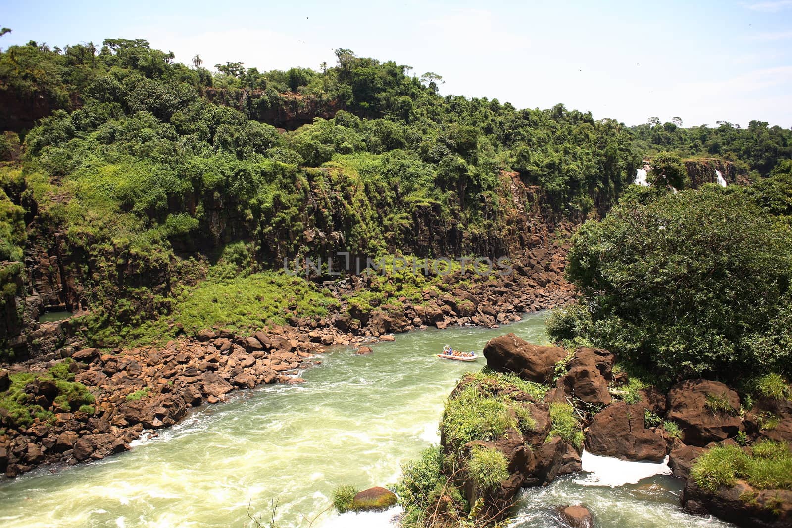 The Iguassu (or Iguazu) Falls is one of the largest masses of fresh water on the planet and divides, in South America, Brazil, Paraguay and Argentina. The waterfall system consists of 275 falls along 2.7 kilometres (1.67 miles) of the Iguazu River. Some of the individual falls are up to 82 metres (269 feet) in height, though the majority are about 64 metres (210 feet).