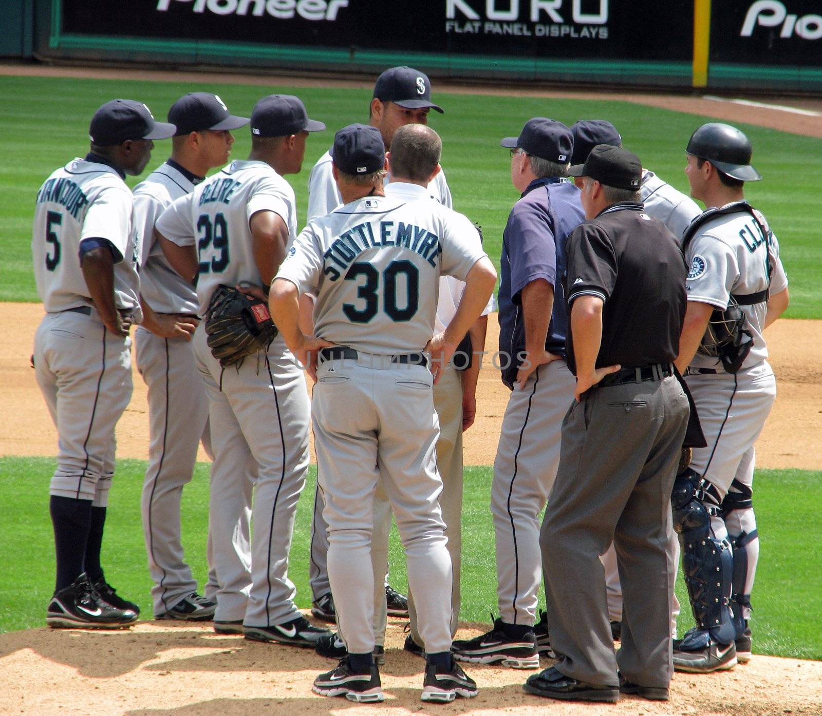 The Seattle Mariners players and coach have a conference on the pitchers mound at a game on May 13, 2008 in Arlington, Texas against the Rangers.