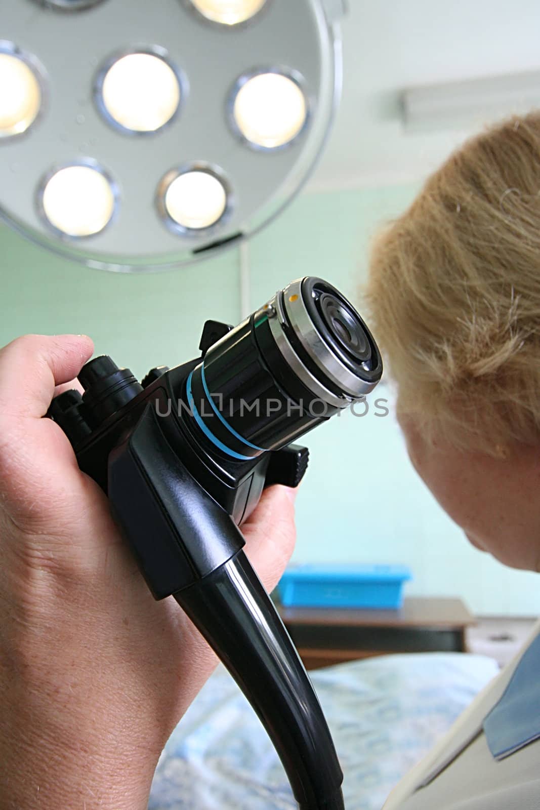 The medical device in a hand at the woman