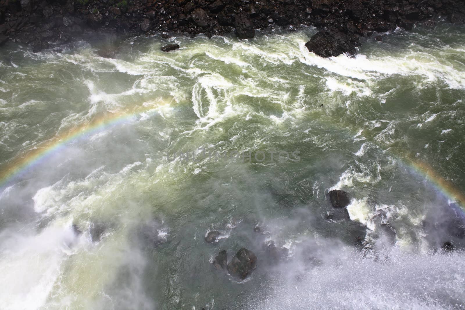 The Iguassu (or Iguazu) Falls is one of the largest masses of fresh water on the planet and divides, in South America, Brazil, Paraguay and Argentina. The waterfall system consists of 275 falls along 2.7 kilometres (1.67 miles) of the Iguazu River. Some of the individual falls are up to 82 metres (269 feet) in height, though the majority are about 64 metres (210 feet).