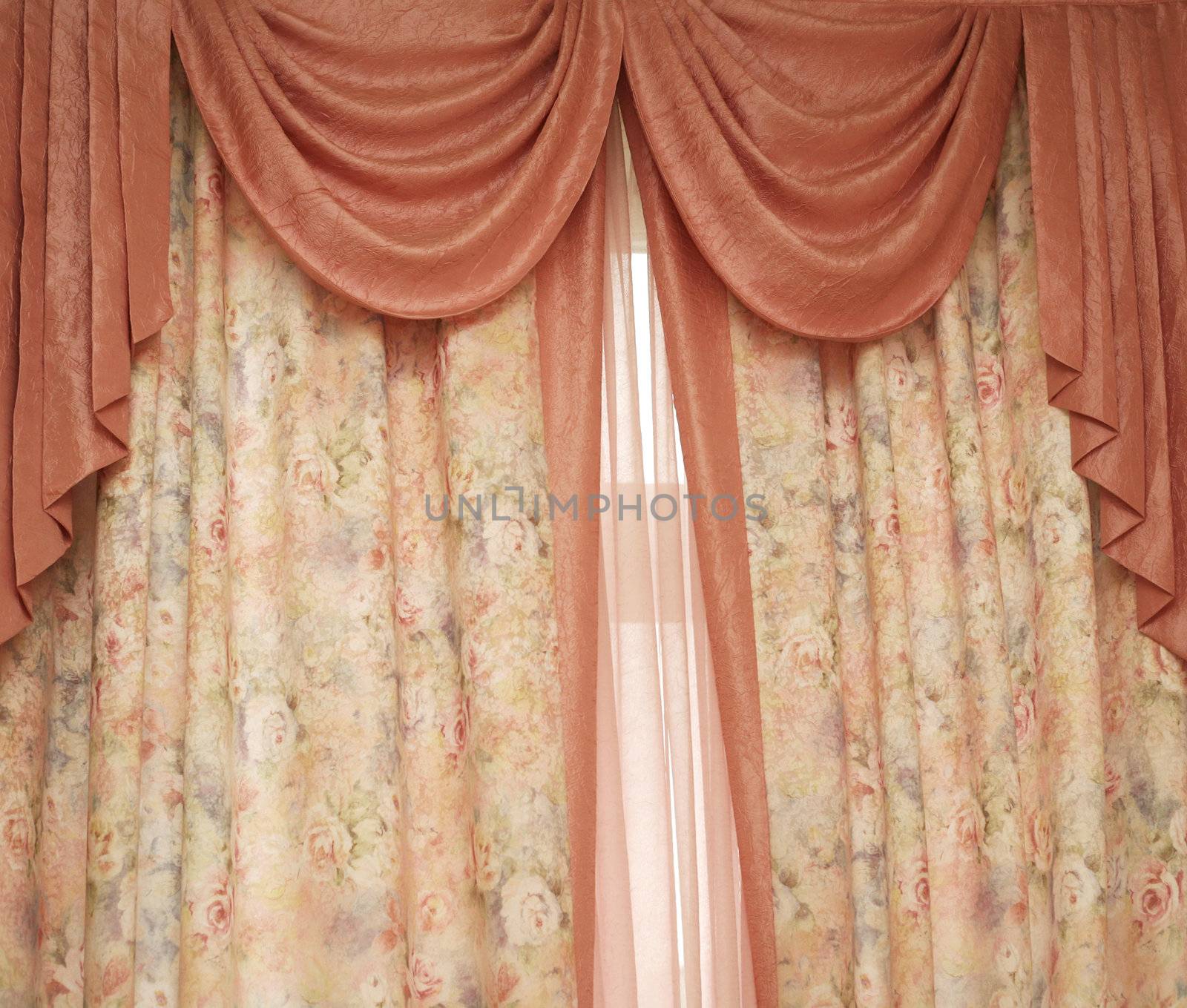 Two pink portieres at a window