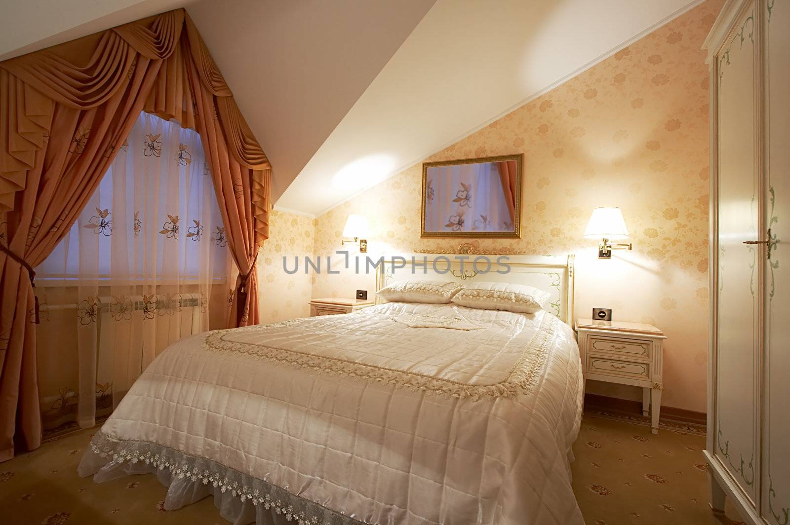 Bedroom with a mirror on a wall in hotel