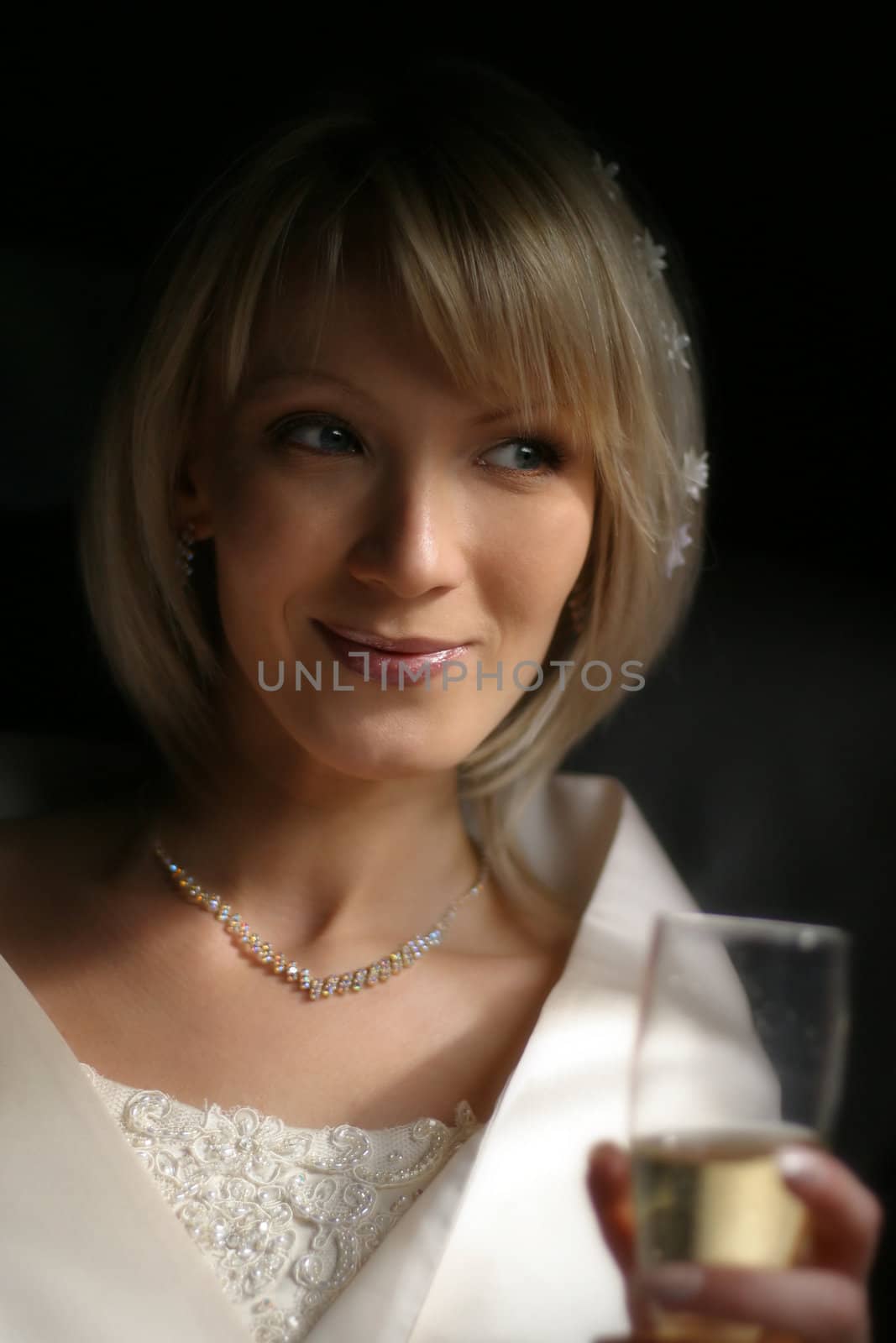 Beautiful bride in the automobile covered by the sun the hair