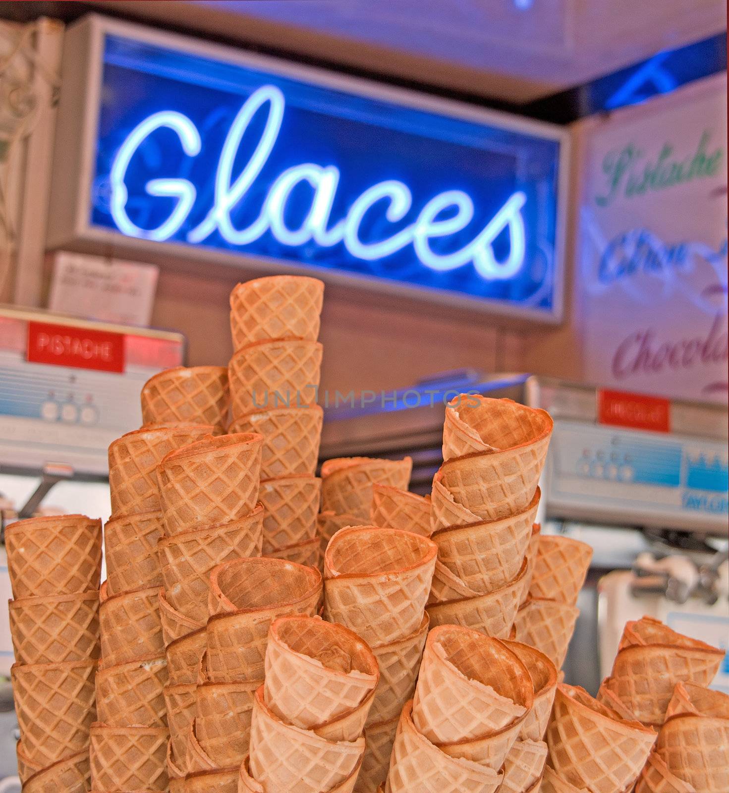 some ice cream cones in a stand. childish pleasure at your fingertips