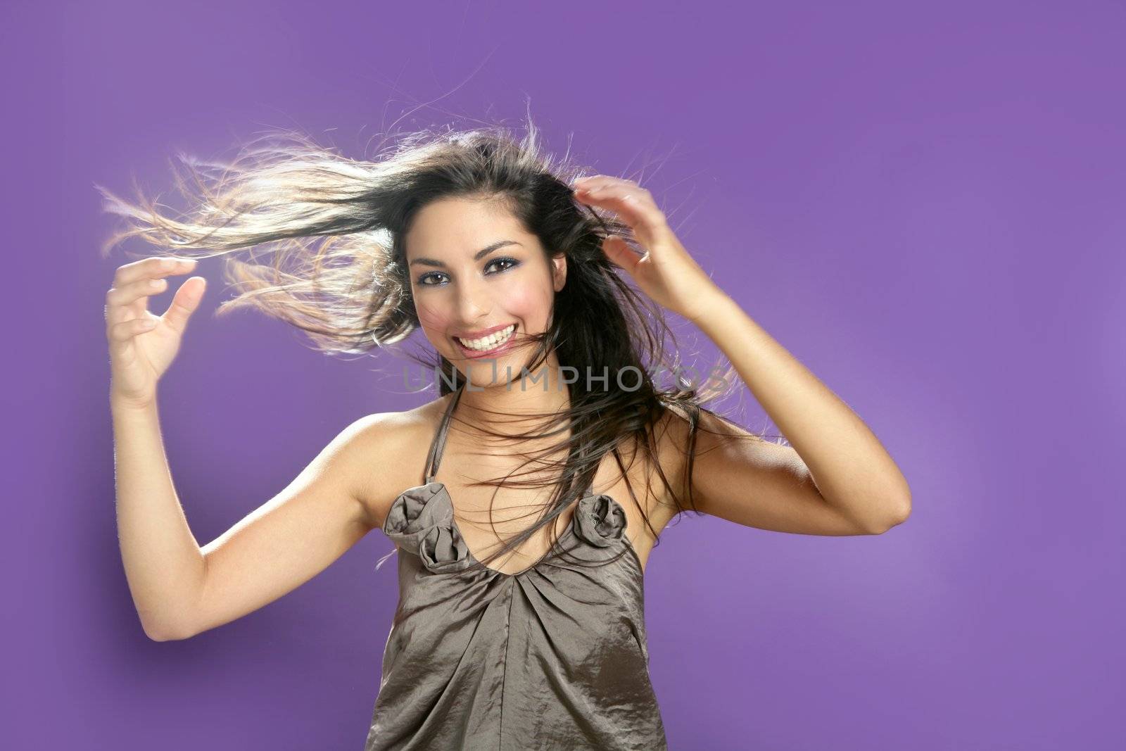 Brunette dancing at studio on purple background by lunamarina