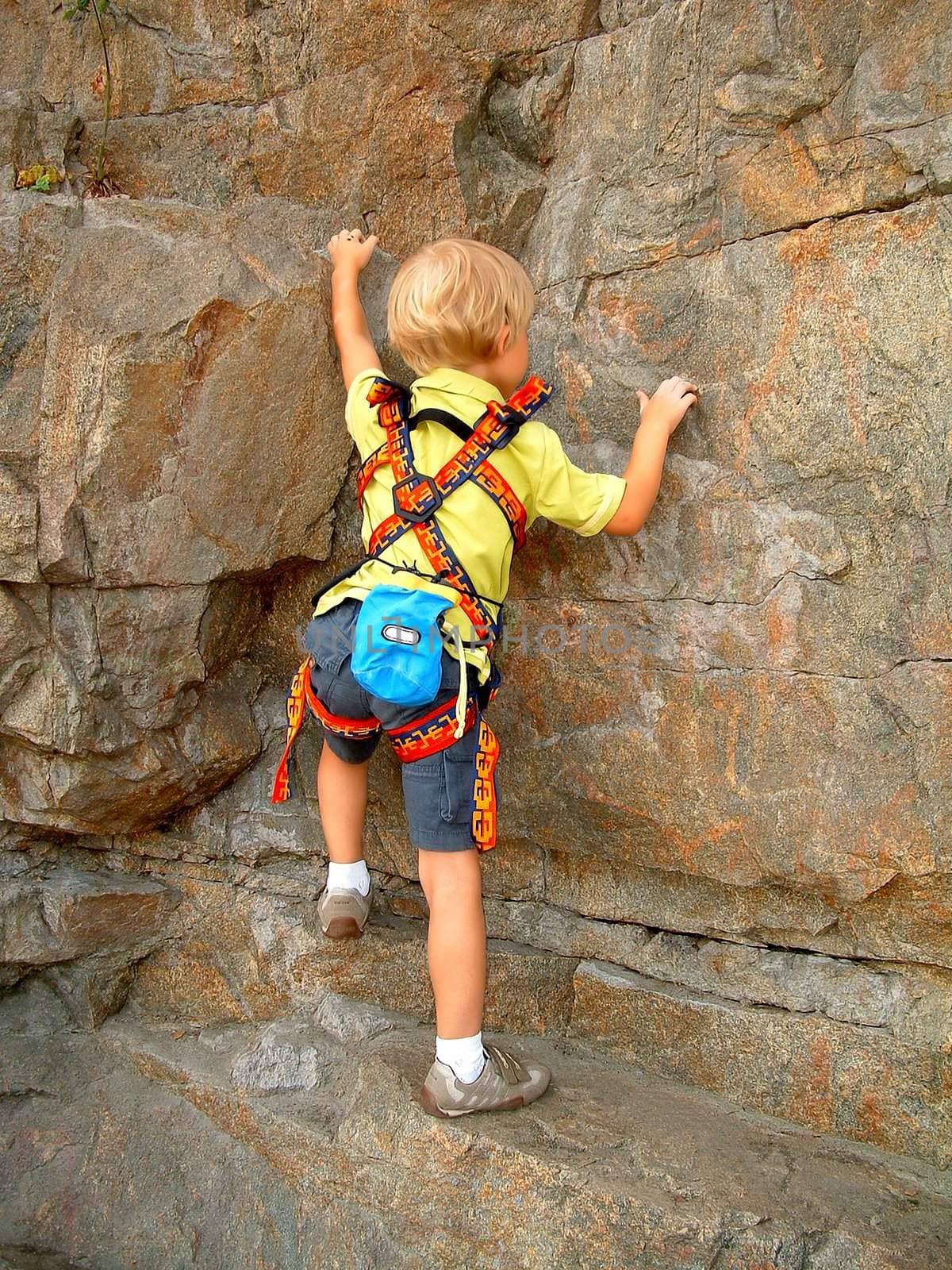 Image of boy cragsman of five years, training to ascend without insurance.