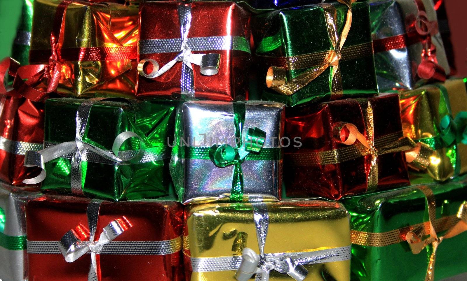 Stack of gifts wrapped in red and green accents