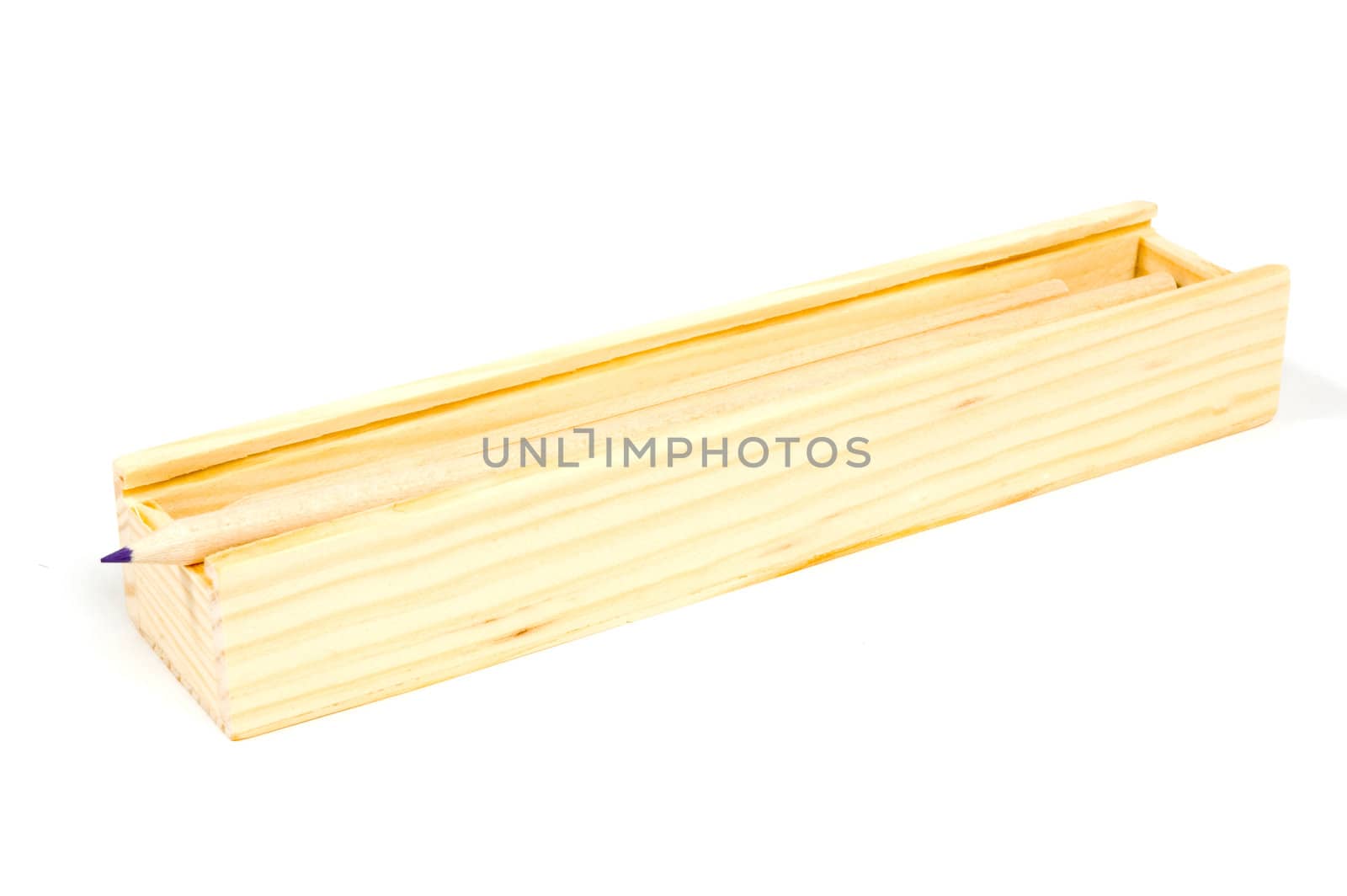  pencils in an old wooden school box isolated on white