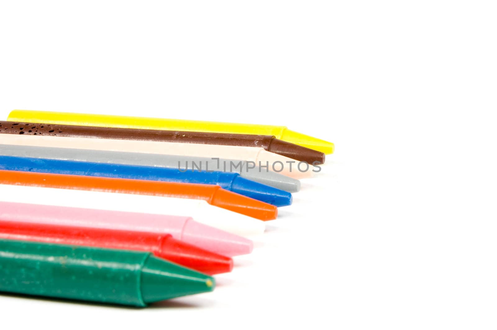 Crayons isolated on white by ladyminnie