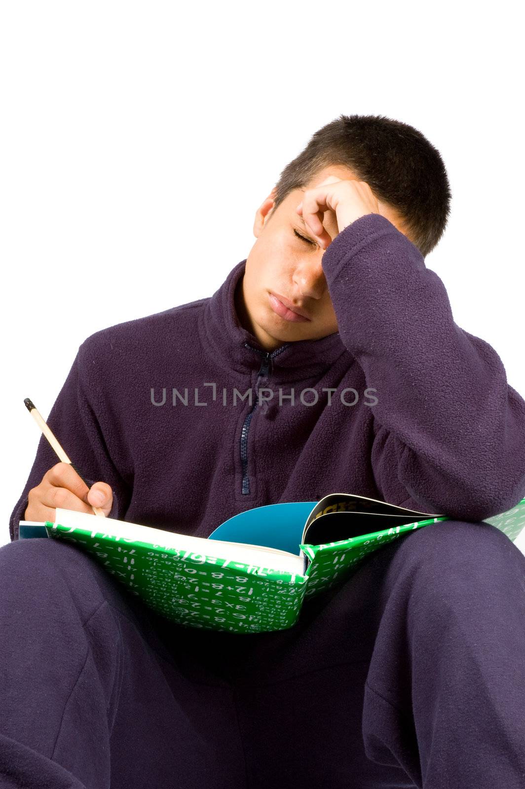 pakistan schoolboy is tired making homework isolated on white