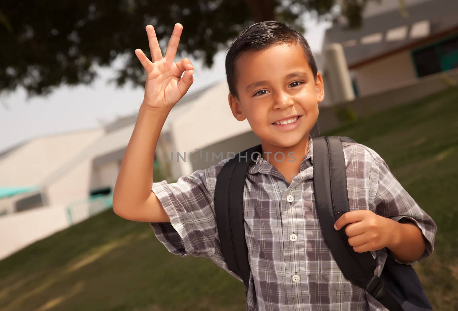 Happy Young Hispanic Boy with Backpack Ready for School.