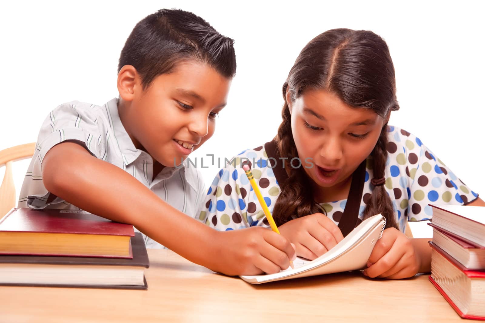 Hispanic Brother and Sister Having Fun Studying by Feverpitched