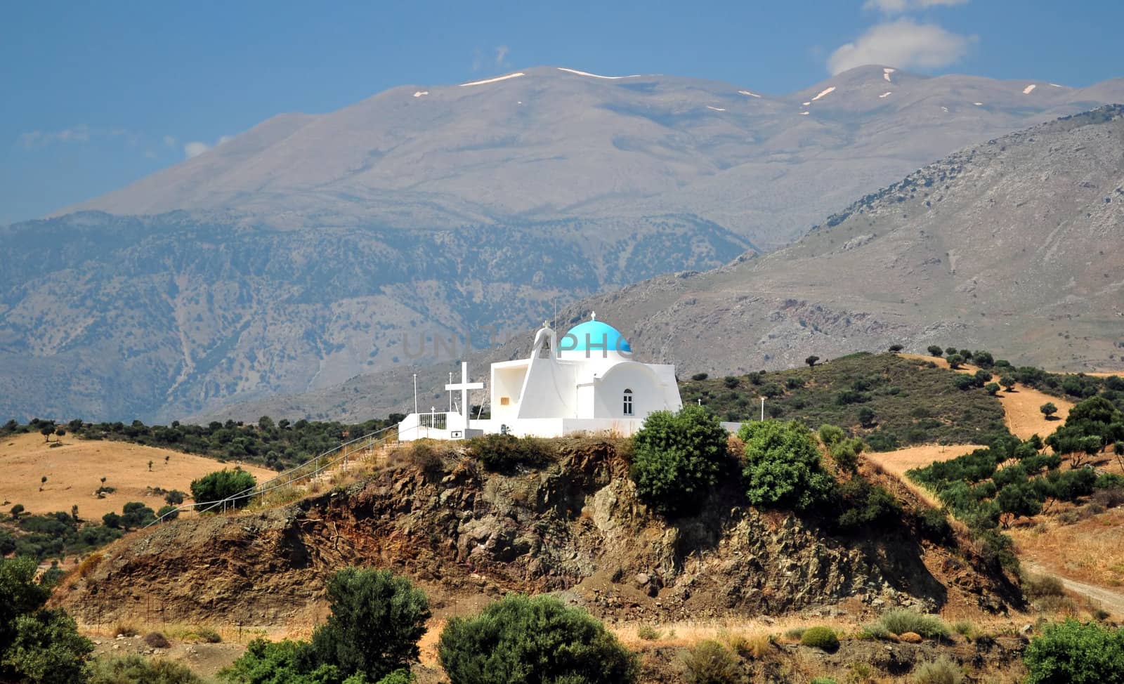 Travel photography: Greek orthodox chapel at the top of a hill, in Crete.