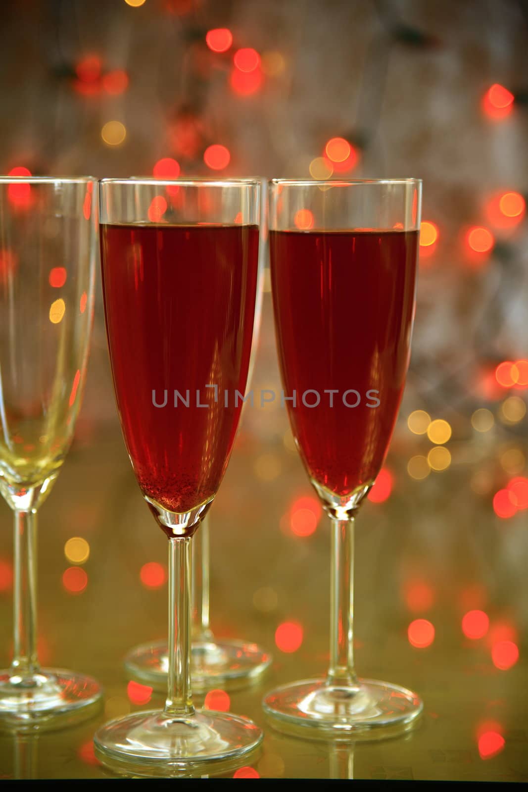 Champagne in glasses and twinkle lights on background