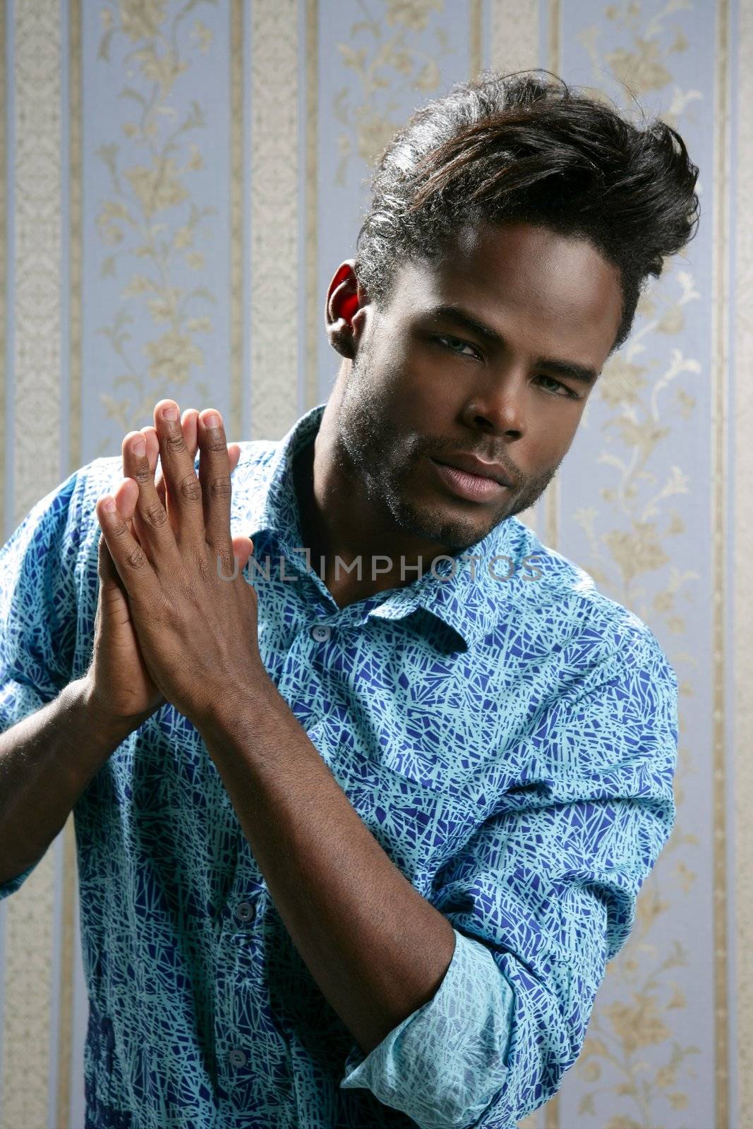 African american fashion model portrait on blue wallpaper background