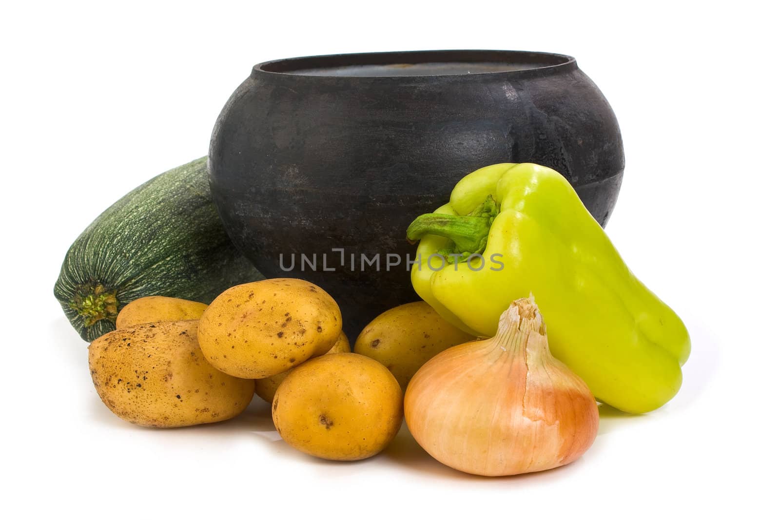 cast iron pot and potato isolated on a white background 