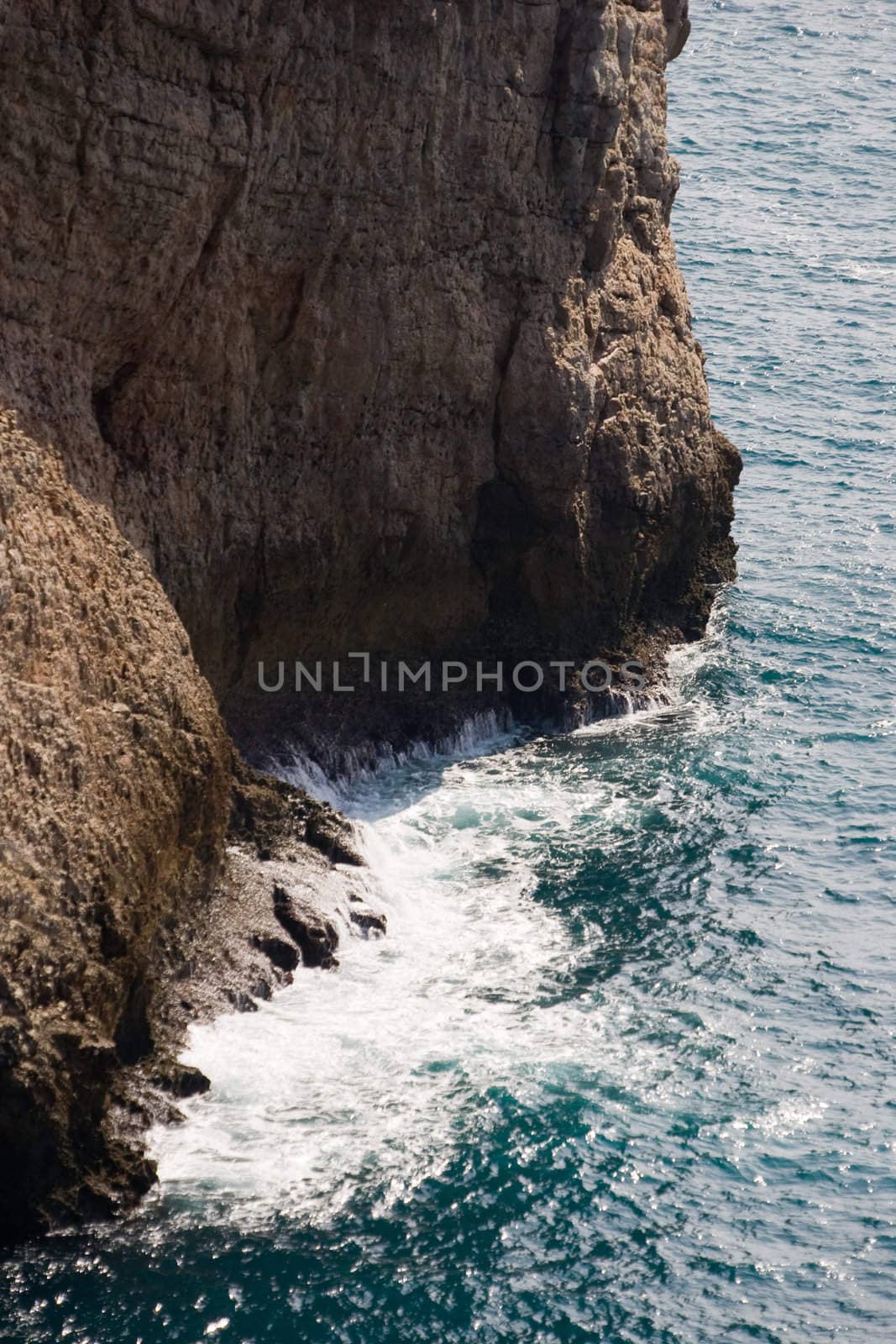 Sheer cliff with crashing waves below.  Cape Saint Vincent, Sagres, Portugal