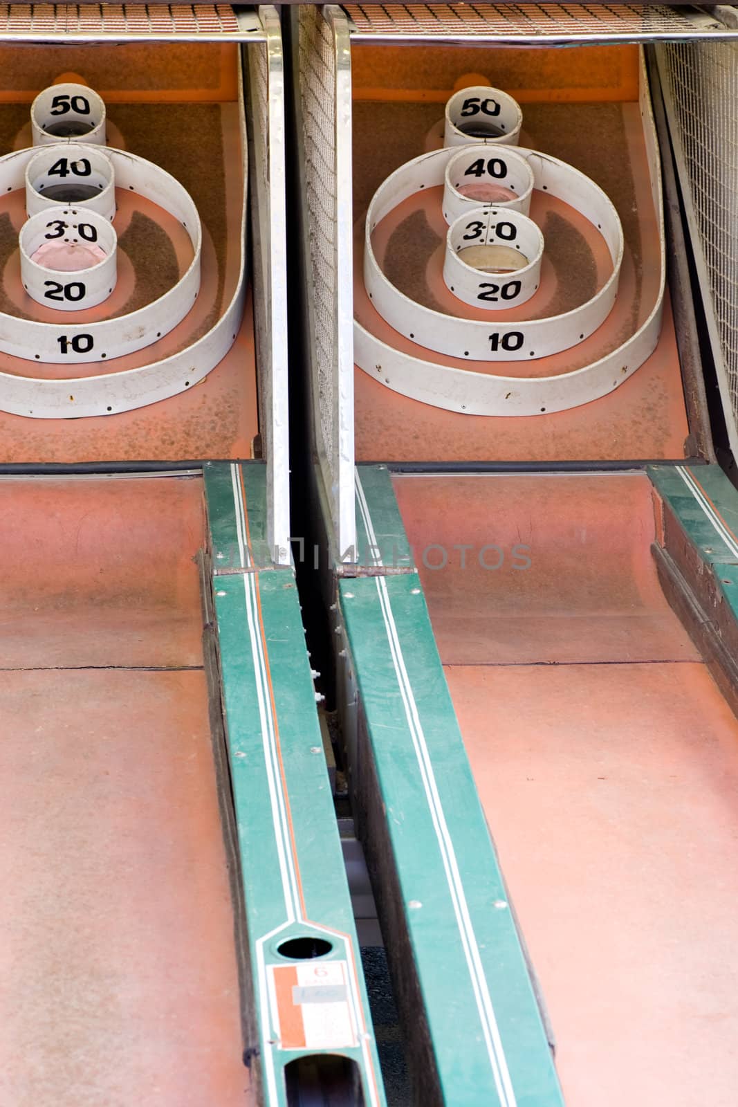 2 lanes of a skeeball game from a traveling amusement company.