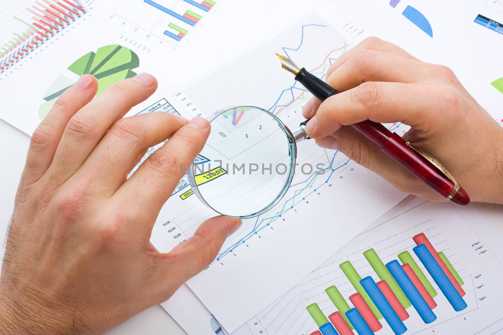 Graphs tables and documents laid on the table