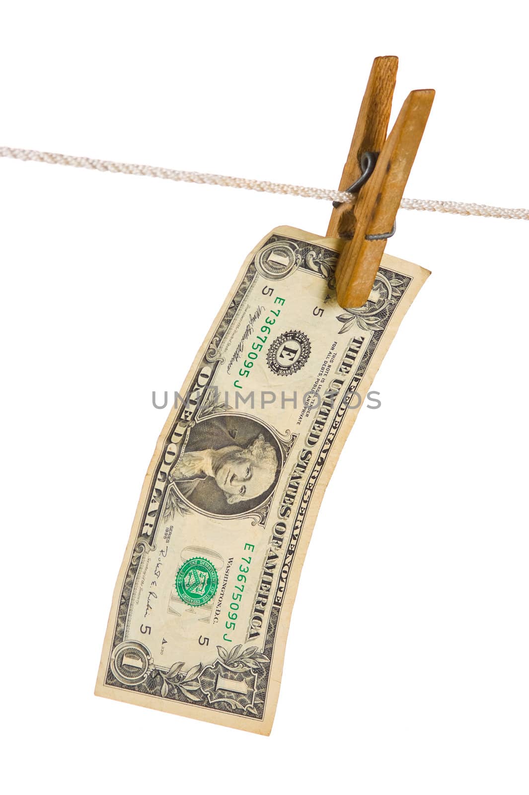 Dollars on clothespin isolated on white background
