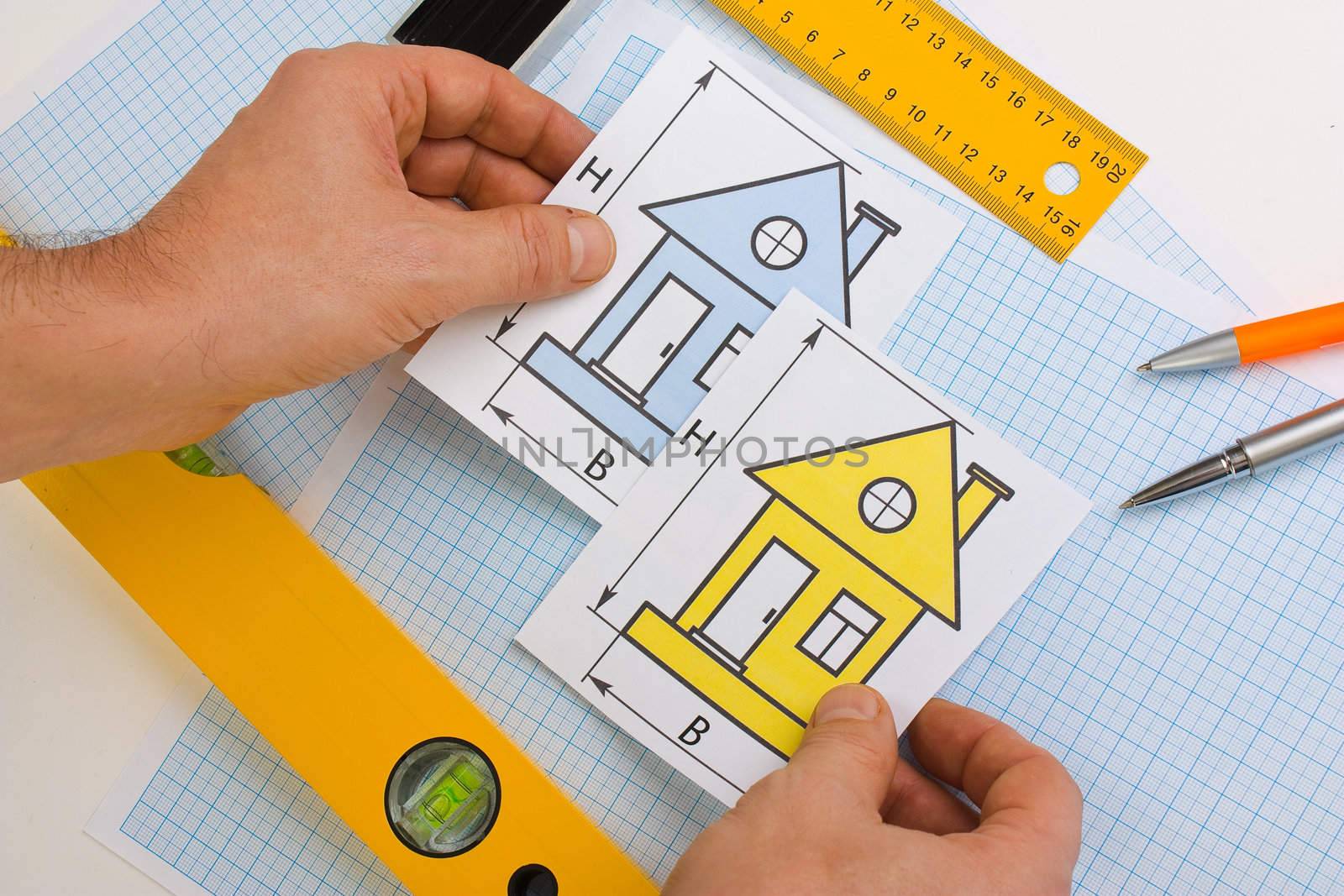 drawing at home with construction tools on a background of graph paper