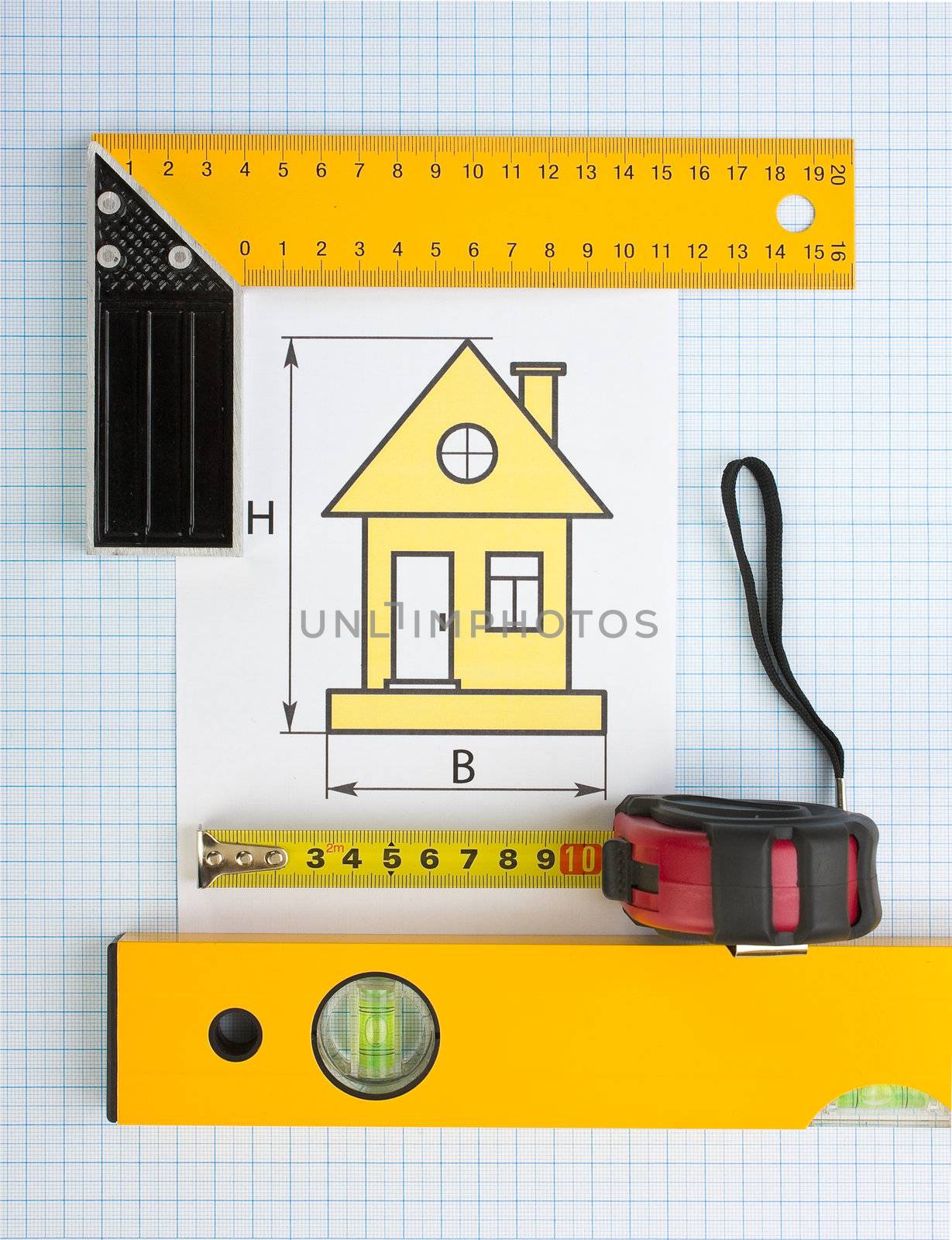 drawing at home with construction tools on a background of graph paper