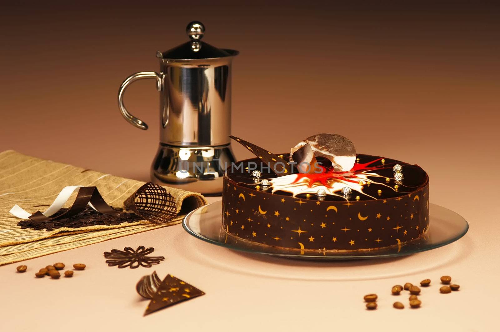 Chocolate cake on a platter with coffee