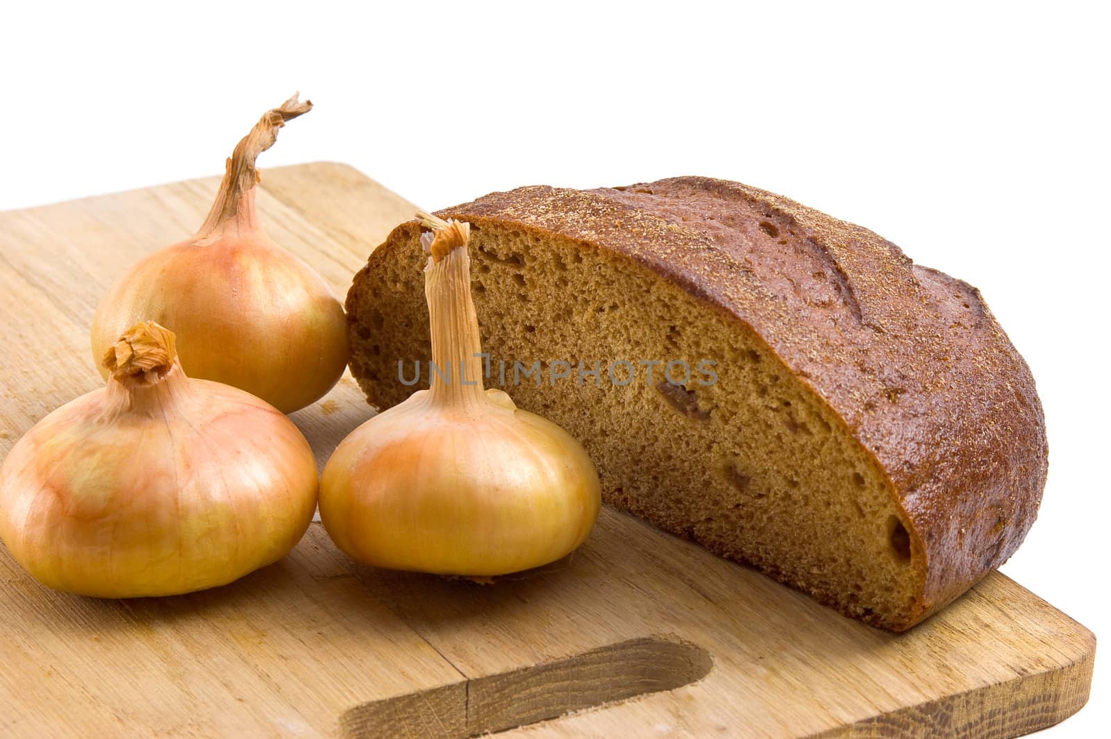 bread and onions on a cutting board isolated on white background