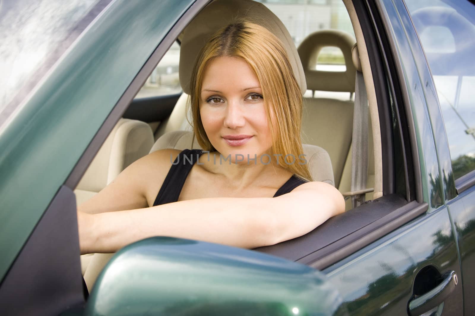 pretty woman looking in the car window