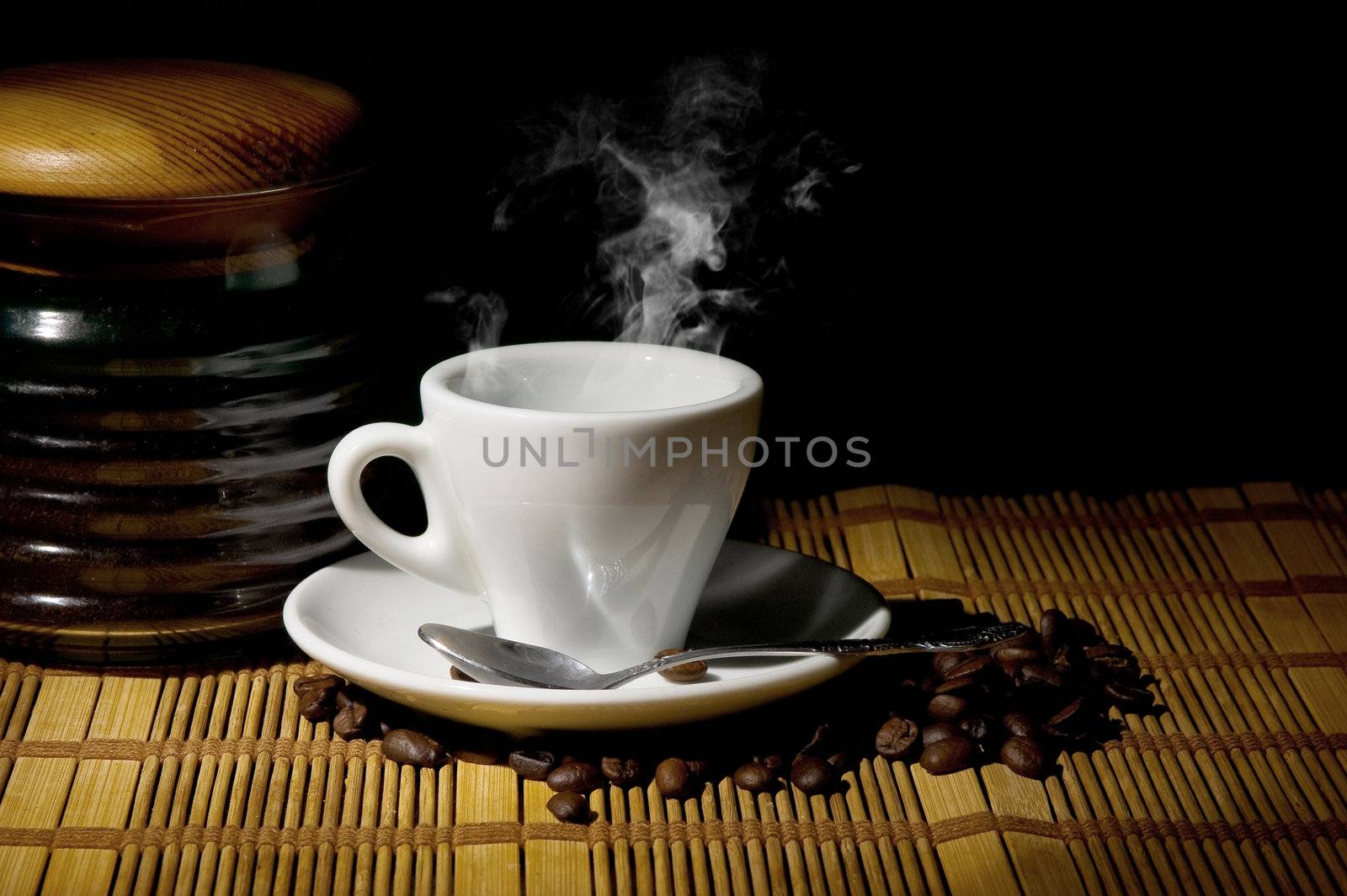 A cup of coffee with coffee beans