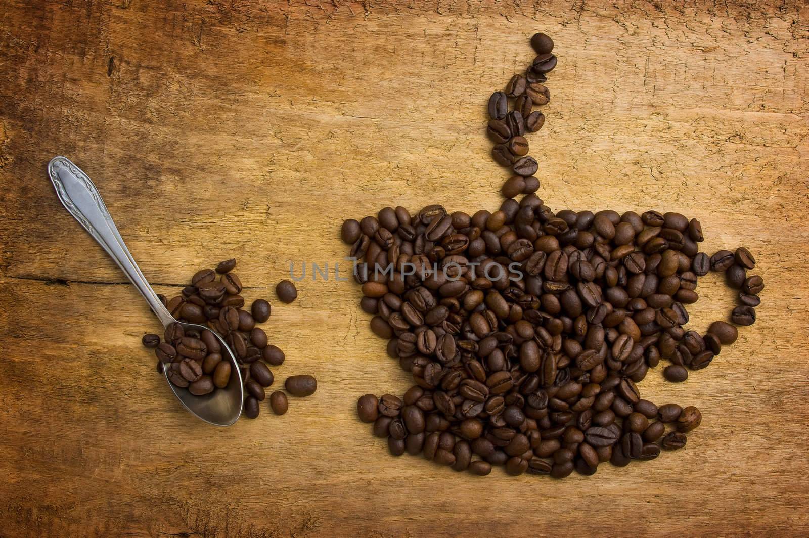 Picture a cup of coffee made from beans on the board