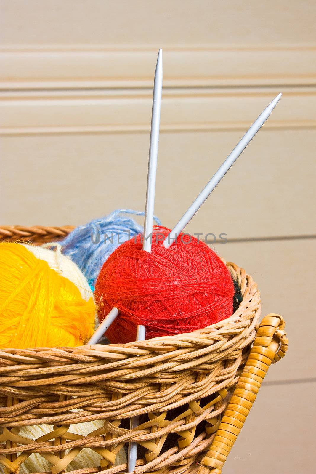 Balls with thread and needles for knitting