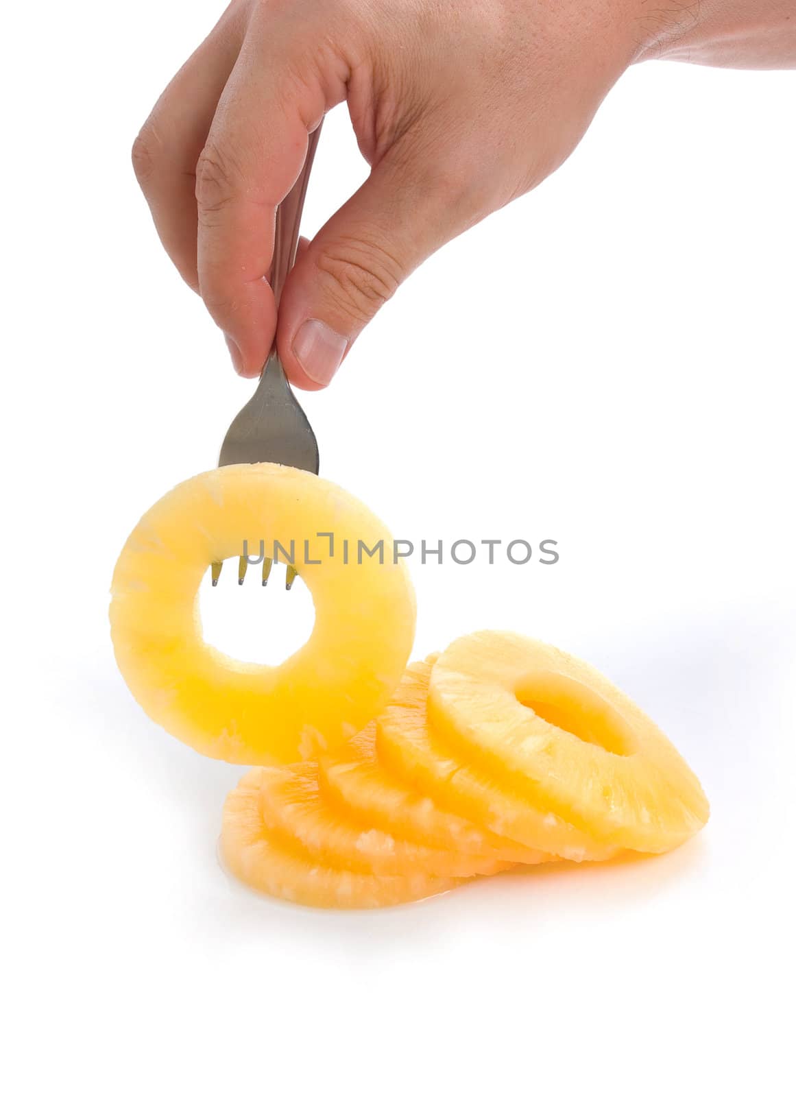 pineapple ring on a fork isolated on white background