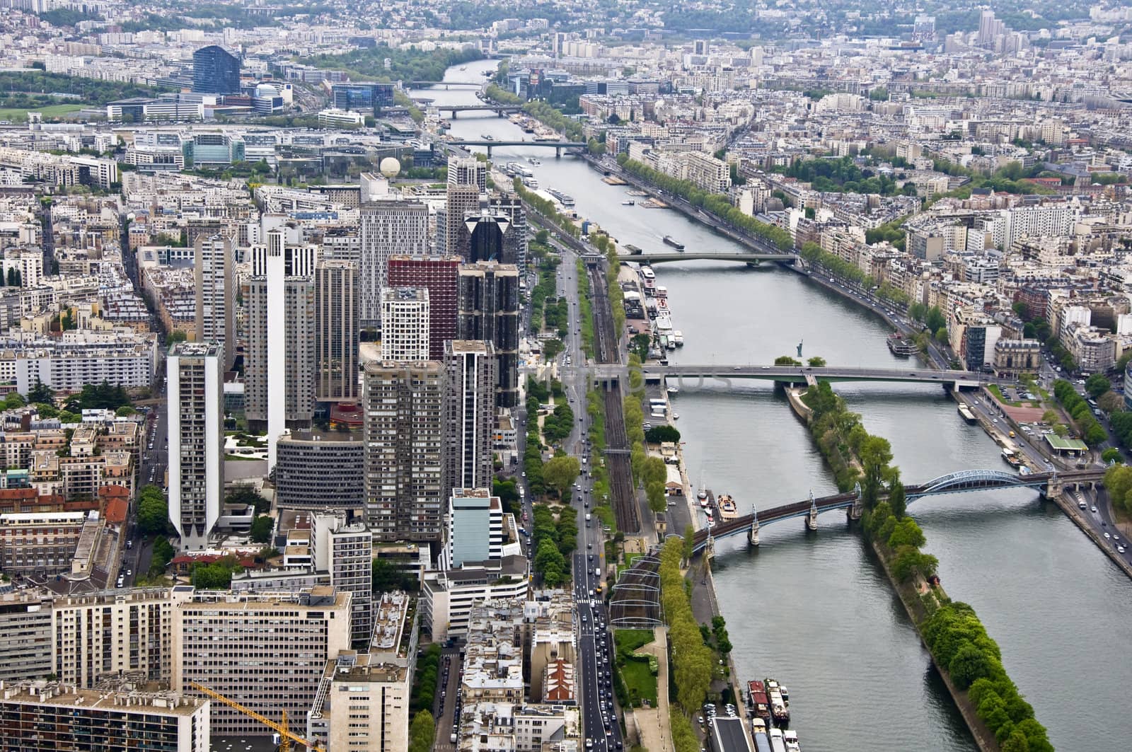 Center of Paris from the heights. View from the Eiffel Tower on the river Seine. Modern architecture.