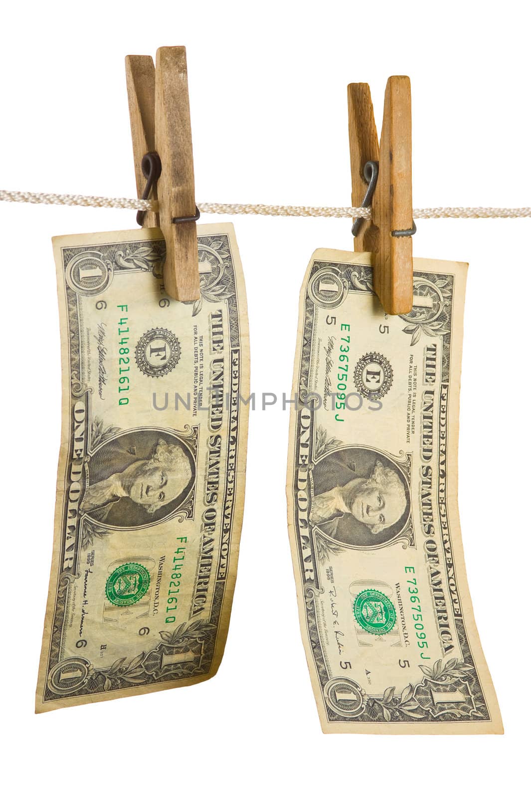 Dollars on clothespin isolated on white background