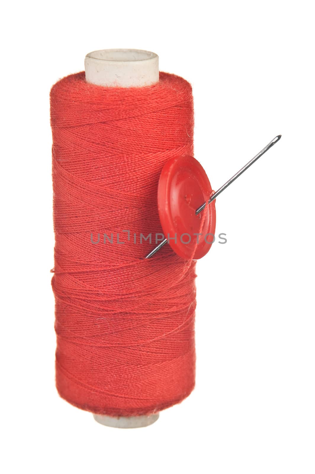Button with a needle on spool of thread by oleg_zhukov