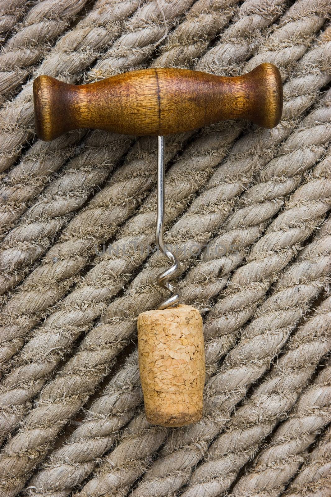 corkscrew with a cork on the background of the rope