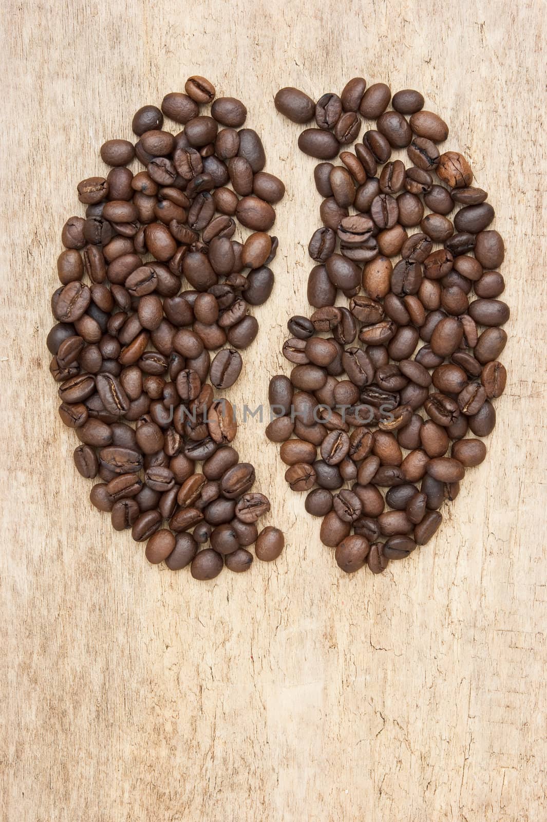 The image is laid out coffee beans on the background of the old board