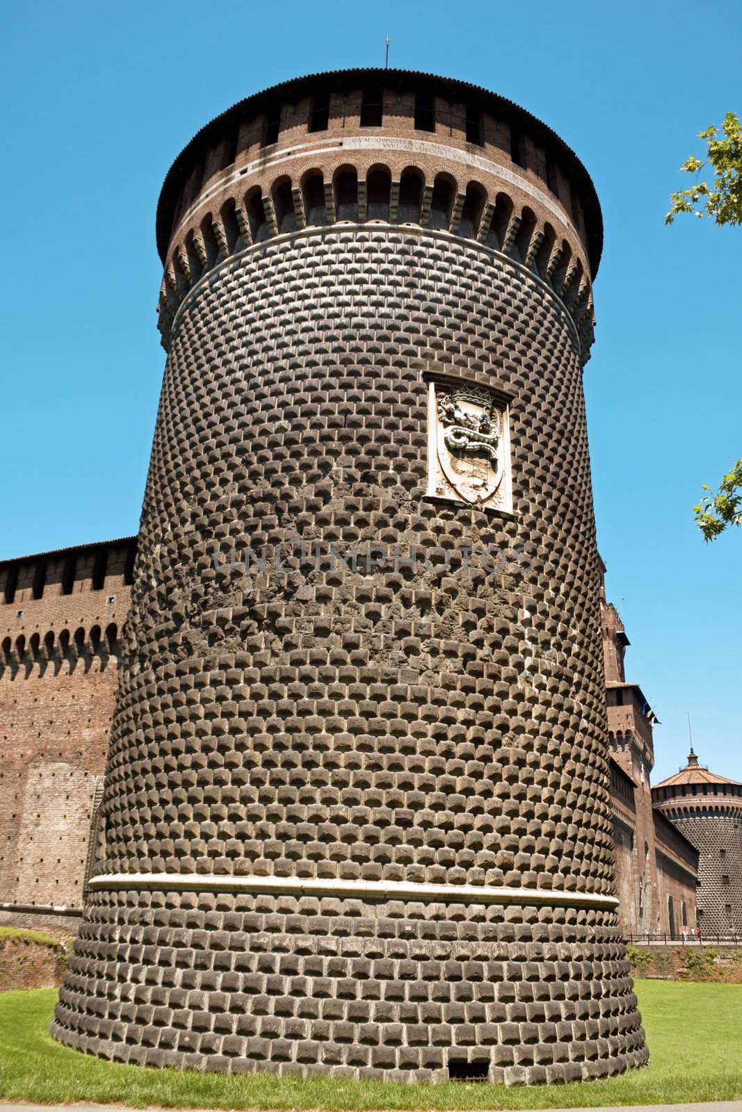 Close-up of one of the cylindrical towers of the Castello Sforzesco in downtown Milan. The Castle was named after Francesco Sforza, who transformed it into a ducal residence in 1450. But its origins date back to the second half of the 14th century, at the time of Galeazzo II Visconti.