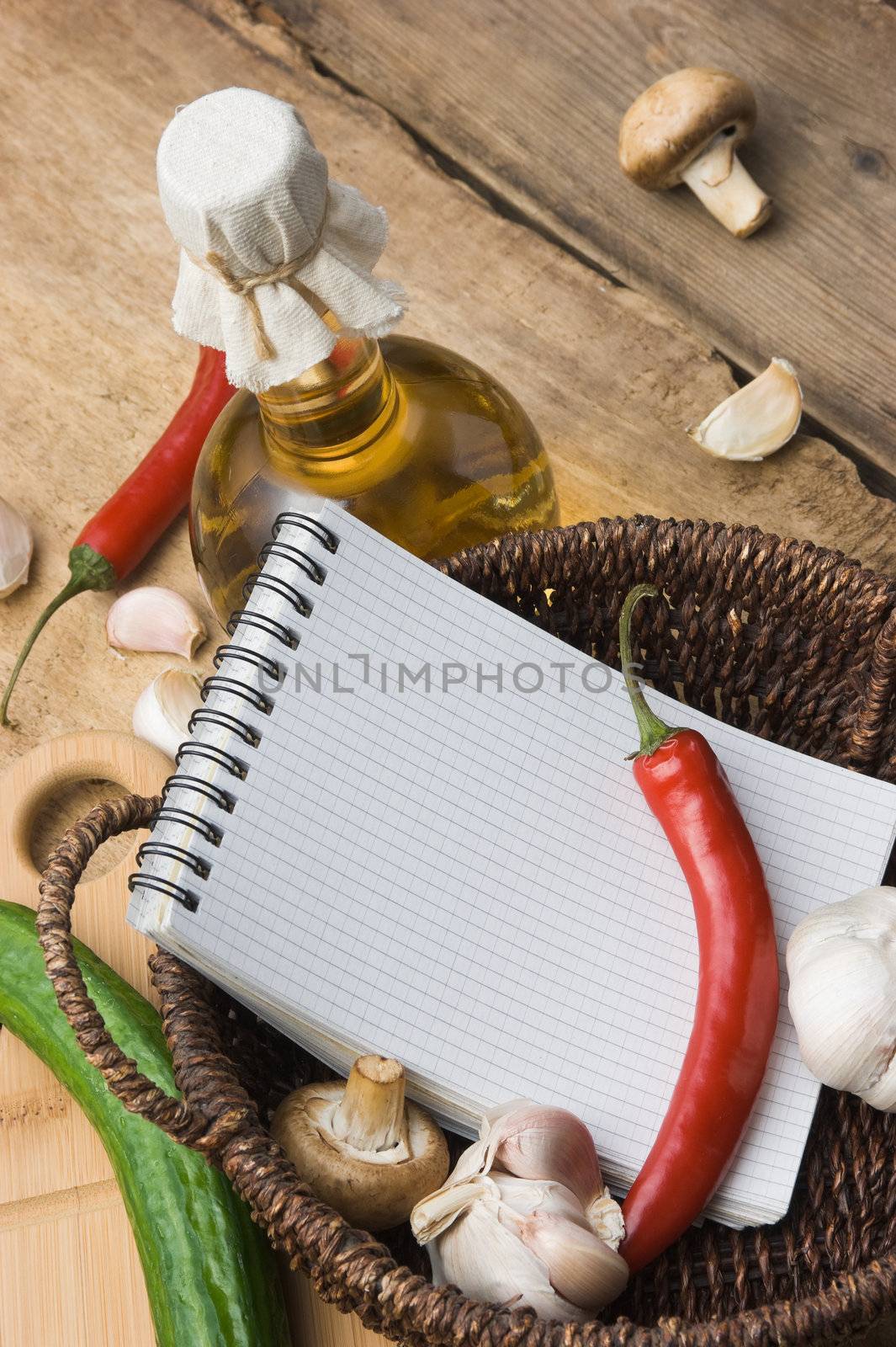 bottle of sunflower oil and vegetables in a country style