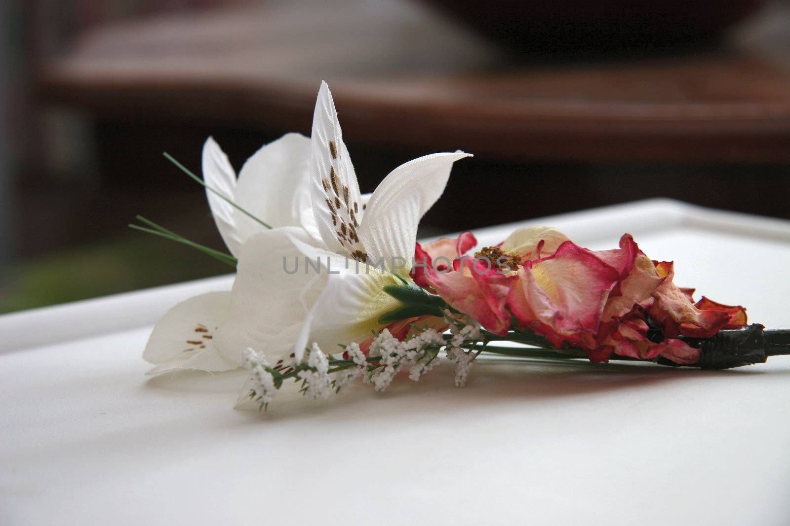 corsage made with dried rose and silk flowers