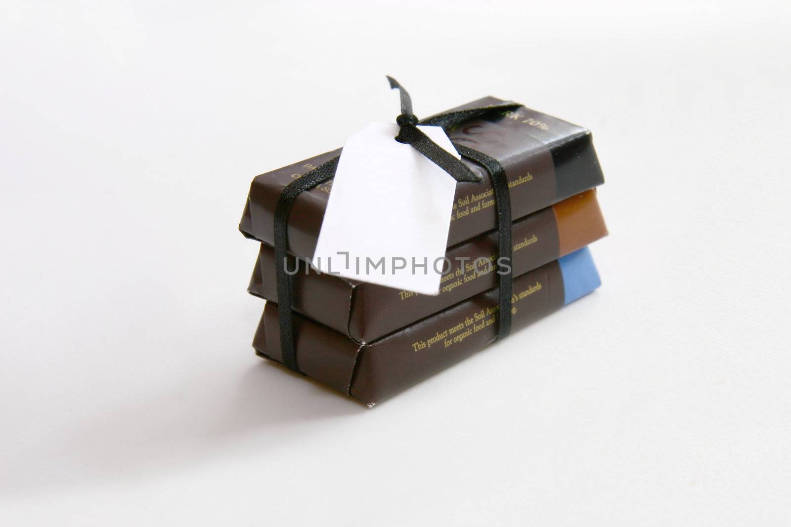 assorted chocolate bars as a small gift set with white tag